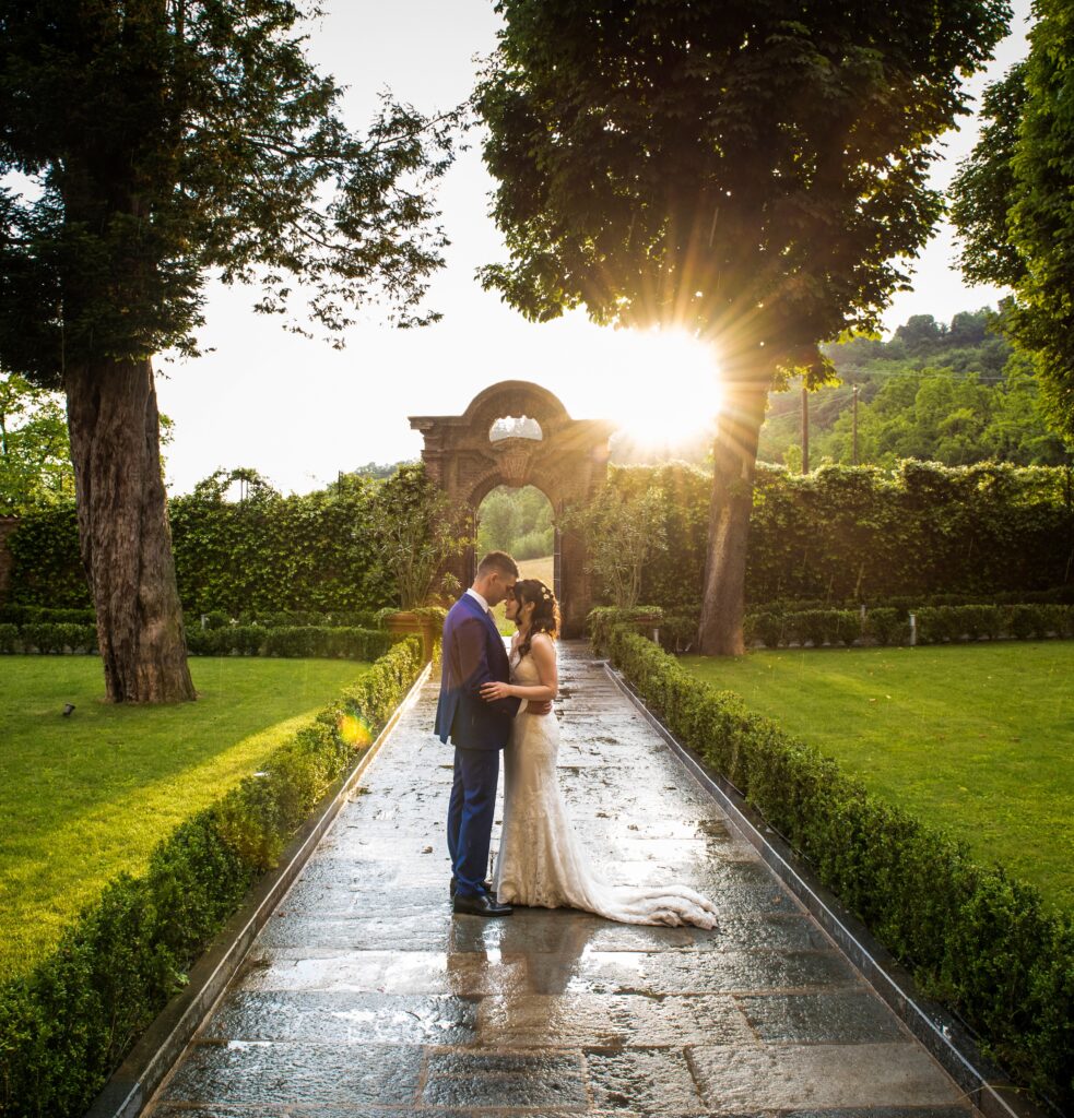 Destination wedding couple after a summer rain in an Italian villa
