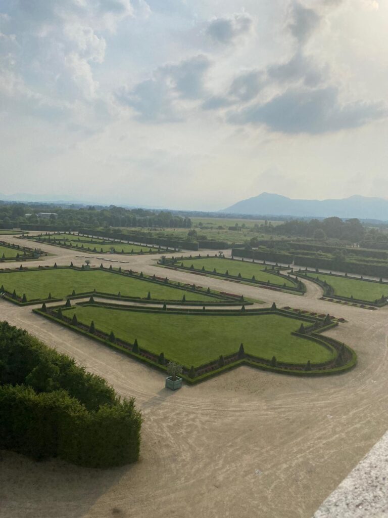 Panoramic view of the gardens of the Reggia di Venaria during a venue visit for a destination wedding in Italy.