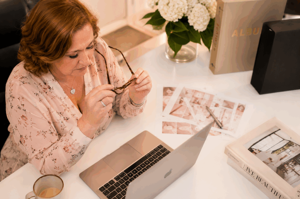 Destination wedding planner in Italy researching venues and planning from her desk