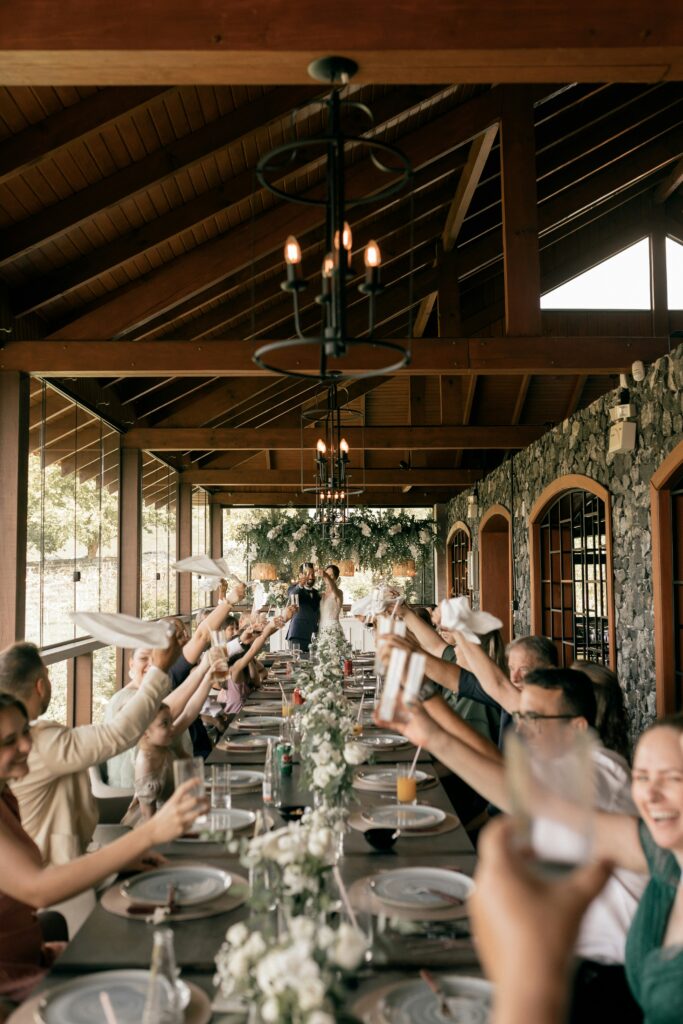 Friends and family enjoying dinner together at a celebration