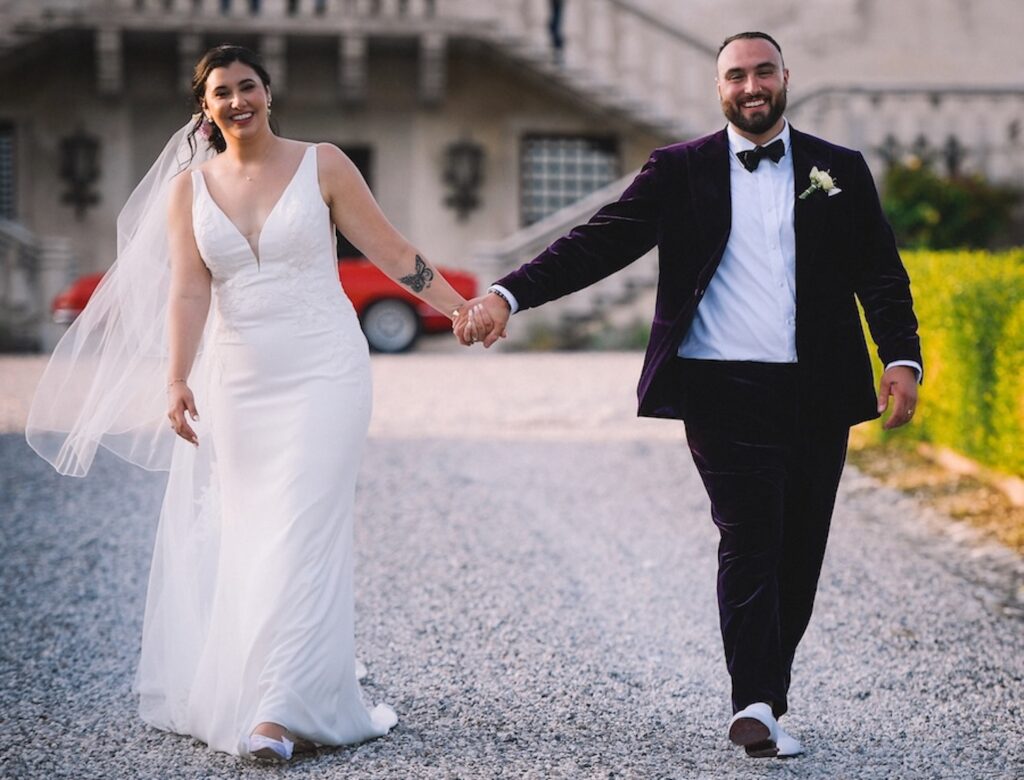 Lauren and Bill walking together on their wedding day in Italy
