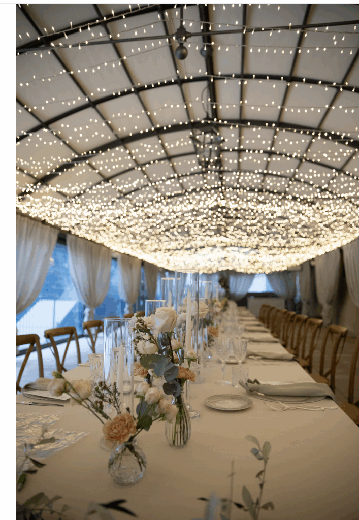 Outdoor wedding dinner in Italy under string lights